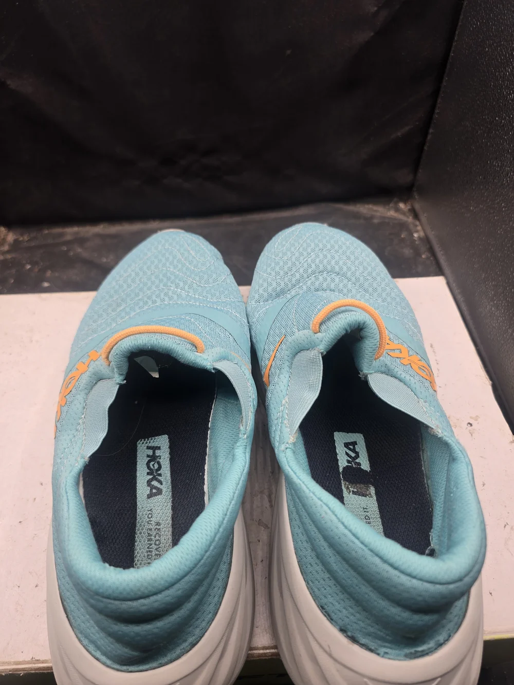 Hoka Women's Slip-On Athletic Shoes in Teal with Orange Accents